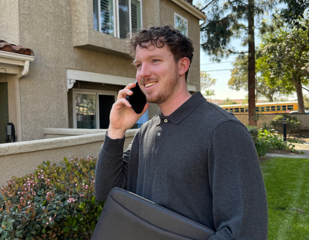 Samuel on the phone with a customer