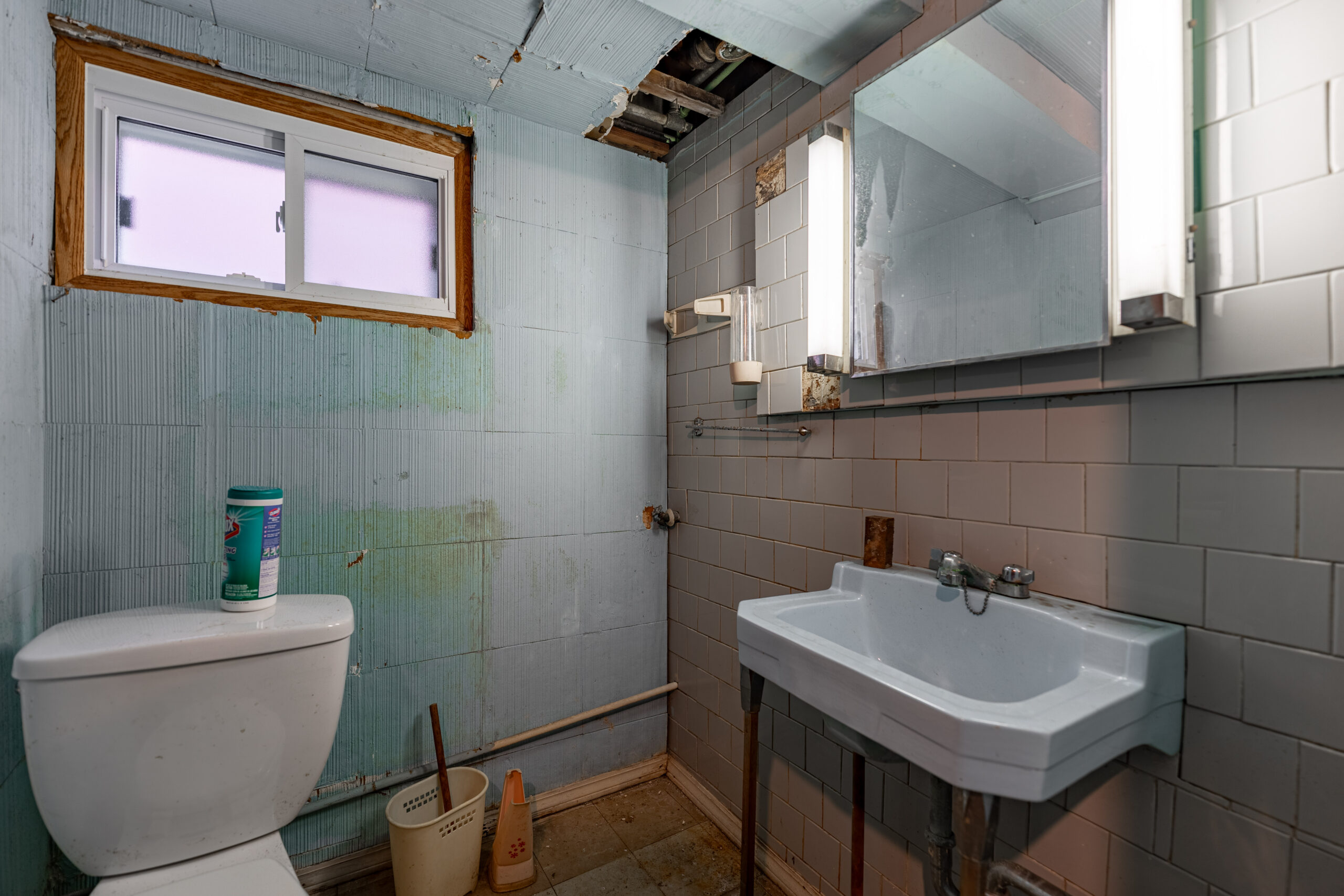 The bathroom of a home in Chicago that needed major repairs